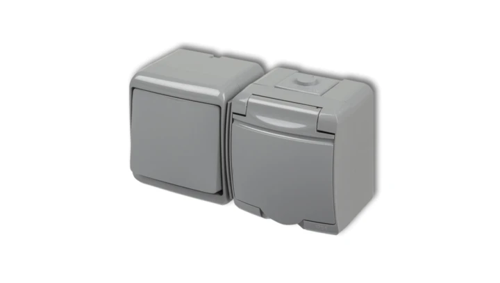 JUNIOR Łącznik jednobiegunowy + gniazdo hermetyczne (klapka popielata) popielaty 10WGHH-1p