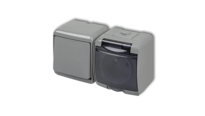 JUNIOR Łącznik jednobiegunowy + gniazdo hermetyczne (klapka dymna) popielaty 10WGHH-1d